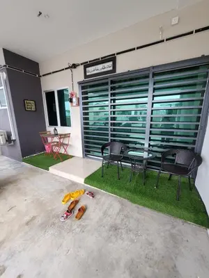 a room with a table and chairs and a toy at Acasa HS in Ipoh