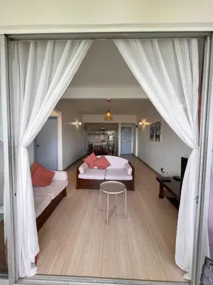 a bedroom with two beds and a table in a room at The Antler Silverpark Fraser's Hill in Bukit Fraser