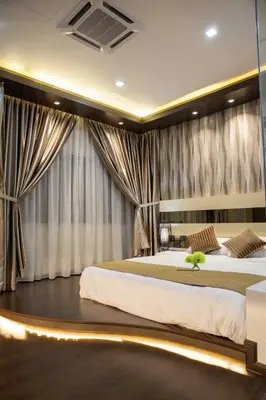 a bedroom with two beds and curtains at Pearl Rice Garden Japanese Style \u7c73\u6a02\u574a\u9802\u5c64\u65e5\u5f0f\u9ad8\u7ea7\u516c\u5bd3 in Sekincan