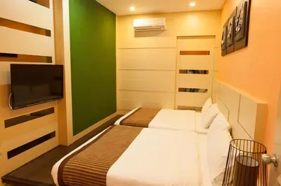 a bedroom with a bed and a flat screen tv at Pearl Rice Garden Japanese Style \u7c73\u6a02\u574a\u9802\u5c64\u65e5\u5f0f\u9ad8\u7ea7\u516c\u5bd3 in Sekincan