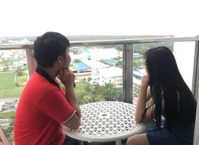 a man and a woman sitting at a table at Pearl Rice Garden Japanese Style \u7c73\u6a02\u574a\u9802\u5c64\u65e5\u5f0f\u9ad8\u7ea7\u516c\u5bd3 in Sekincan