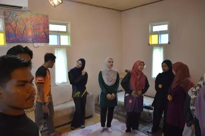 a group of people standing in a room at Afilia 2 in Kuala Kangsar