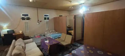 a living room with a couch and a table at Afilia 2 in Kuala Kangsar