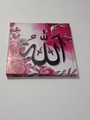 a book with asian writing on it with pink flowers at HOMESTAY IMPIAN QASEH MANJUNG (MUSLIM) in Seri Manjung