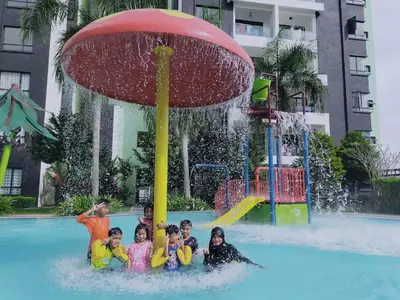 a group of children in a pool in a water park at Razads Waterpark Homestay Ipoh in Ipoh