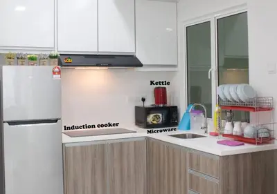 a kitchen with white cabinets and a white refrigerator at H2H - Holland Cottage - Majestic Ipoh - 7pax in Ipoh