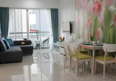 a living room with a couch and a table and chairs at H2H - Holland Cottage - Majestic Ipoh - 7pax in Ipoh