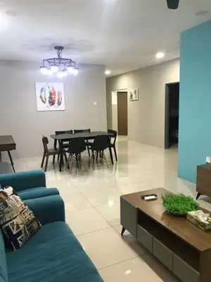 a living room with a blue couch and a table at Ipoh Manhattan TSL Pool View Water Park Homestay! in Kampong Pinji
