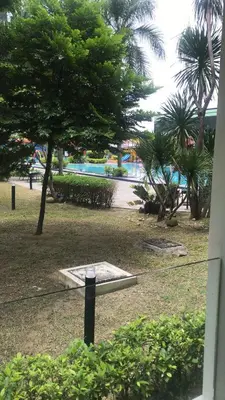 a view of a park with trees and a pool at Ipoh Manhattan TSL Pool View Water Park Homestay! in Kampong Pinji