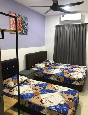 a bedroom with two beds and a ceiling fan at Ipoh Manhattan TSL Pool View Water Park Homestay! in Kampong Pinji