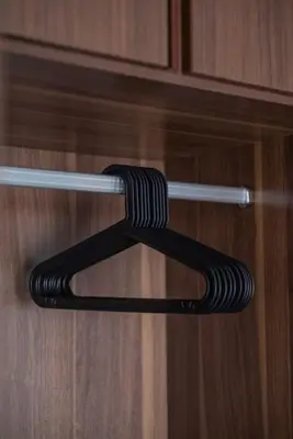 a black object is hanging on a cabinet door at Deluxe Seaview Suite Twin Bed by The Only Bnb in Tanjong Tokong