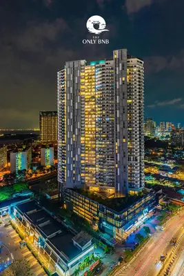 a large building with a sign on top of it at Deluxe Seaview Suite Twin Bed by The Only Bnb in Tanjong Tokong