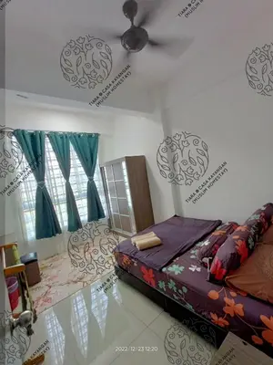 a bedroom with a bed and a ceiling fan at TIARA @ CASA KAYANGAN (MUSLIM HOMESTAY) in Ipoh