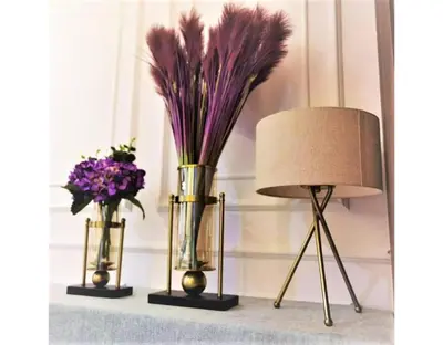 two vases with purple flowers and a lamp on a shelf at \u5317\u6b27ING\u98ce\u683c\u8c6a\u534e\u65e5\u51fa\u6d77\u666f\u5957\u623f Nordic ING Luxury Seaview Suite in Tanjong Tokong