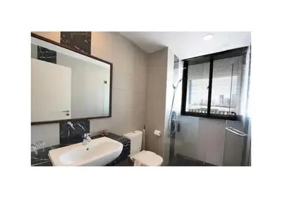 a bathroom with a sink and a shower and a toilet at \u5317\u6b27ING\u98ce\u683c\u8c6a\u534e\u65e5\u51fa\u6d77\u666f\u5957\u623f Nordic ING Luxury Seaview Suite in Tanjong Tokong