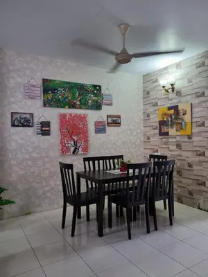 a dining room with a black table and chairs at Ssue Klebang Ipoh Homestay With Complementary Pool & High Speed internet WIFI in Chemor