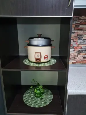 a shelf with a pot and a plate of food at Ssue Klebang Ipoh Homestay With Complementary Pool & High Speed internet WIFI in Chemor