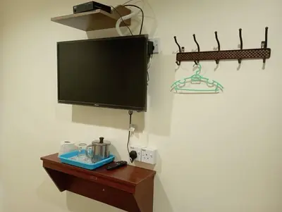 a flat screen tv hanging on a wall at CH Budget Hotel in Cameron Highlands
