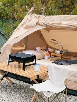 a tent with a table and chairs in front of it at Stellar GoldenHill Cameron in Tanah Rata
