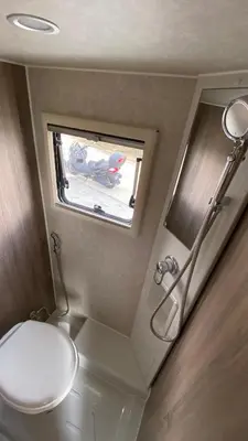 a small bathroom with a toilet and a window at Stellar GoldenHill Cameron in Tanah Rata