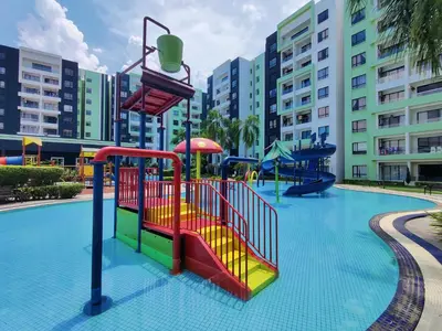 a playground in a resort with a slide at KT's Homestay- Corner Unit - Manhattan Ipoh Water Park- Station 18 in Ipoh