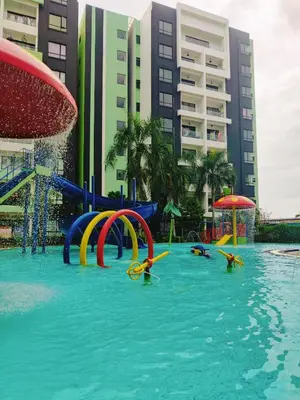 a pool with a water park with a water slide at KT's Homestay- Corner Unit - Manhattan Ipoh Water Park- Station 18 in Ipoh