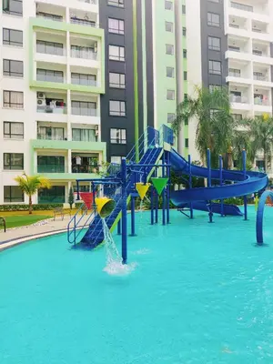 a playground in a pool of water in a city at KT's Homestay- Corner Unit - Manhattan Ipoh Water Park- Station 18 in Ipoh