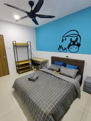 a bedroom with a bed with a ceiling fan at KT's Homestay- Corner Unit - Manhattan Ipoh Water Park- Station 18 in Ipoh