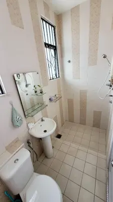 a bathroom with a toilet and a sink at JackBeansprouts Homestay Botani Ipoh in Ipoh