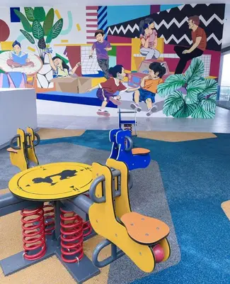 a childrens play area with a table and chairs in a playground at #12Georgetown Luxury Suite with Rooftop Pool in George Town