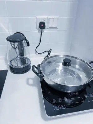 a pot sitting on top of a stove at #12Georgetown Luxury Suite with Rooftop Pool in George Town