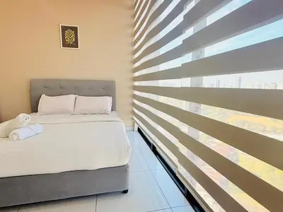a bedroom with a bed and a window with blinds at New 2BR Georgetown Warm and Lovely Homestay 10pax-\u65e0\u654c\u7f8e\u666f\u4e24\u623f\u6c11\u5bbf Beacon Executive Suite in George Town