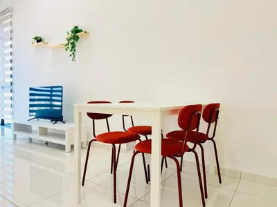 a white table with red chairs in a room at New 2BR Georgetown Warm and Lovely Homestay 10pax-\u65e0\u654c\u7f8e\u666f\u4e24\u623f\u6c11\u5bbf Beacon Executive Suite in George Town