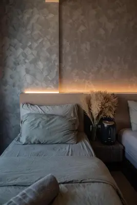 a bedroom with a bed with a headboard and a lamp at Opulent Seaview Projector Lounge by The Only Bnb in Tanjong Tokong