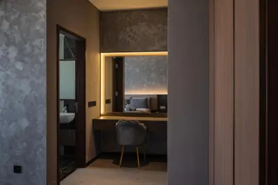 a bathroom with a vanity with a mirror and a sink at Opulent Seaview Projector Lounge by The Only Bnb in Tanjong Tokong