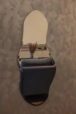 a chair with a table with a lamp on it at Opulent Seaview Projector Lounge by The Only Bnb in Tanjong Tokong