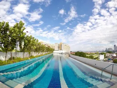 a large swimming pool on the roof of a building at Opulent Seaview Projector Lounge by The Only Bnb in Tanjong Tokong
