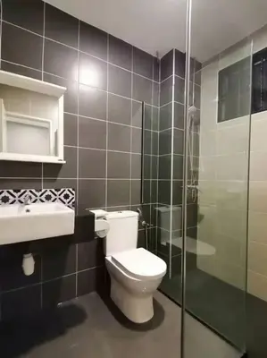 a bathroom with a toilet and a glass shower at Cameron top31 golden hills night market homestay in Brinchang