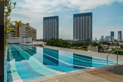 a swimming pool on the roof of a building with buildings at Family Seaview Suite with 3 Rooms by The Only Bnb in Tanjong Tokong