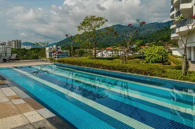 a swimming pool on the side of a building at Family Seaview Suite with 3 Rooms by The Only Bnb in Tanjong Tokong