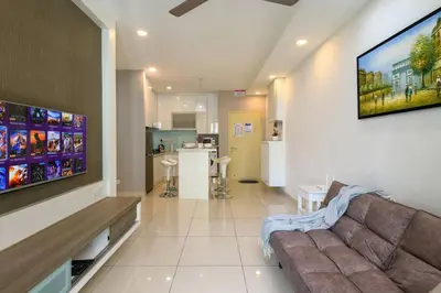 a living room with a couch and a tv at 2R2B/Cosy House/1~8pax/Gurney/Mansion One in George Town