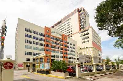 a large building on a street in a city at 2R2B/Cosy House/1~8pax/Gurney/Mansion One in George Town