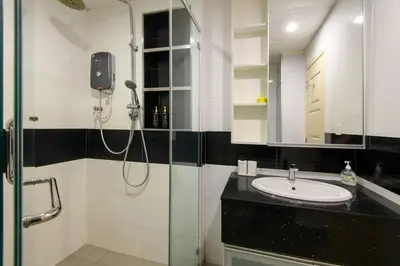 a bathroom with a shower and a sink at 2R2B/Cosy House/1~8pax/Gurney/Mansion One in George Town