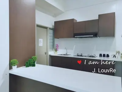 a kitchen with a white counter top in a room at Golden Hills Pasar Malam 3 Bedroom Apartment J LouvRe in Tanah Rata