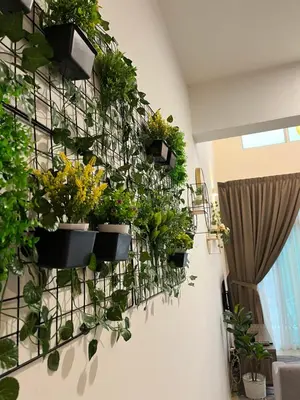 a wall filled with potted plants on a wall at Aloft Cameron Highland in Brinchang