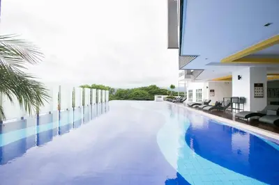 a swimming pool in the middle of a building at THE MAJESTIC IPOH A8 by ZamanJa in Ipoh