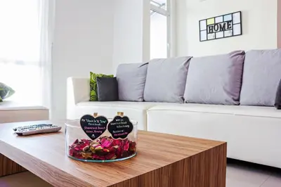 a living room with a coffee table with hearts on it at Shamrock Beach Villas Batu Ferringhi Penang in Batu Ferringhi