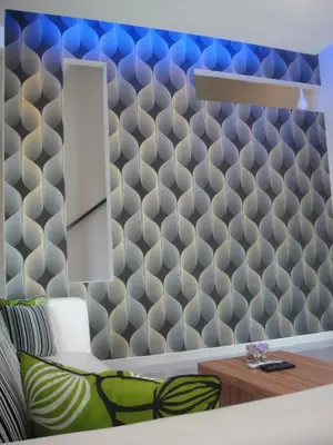 a living room with a patterned wall at Shamrock Beach Villas Batu Ferringhi Penang in Batu Ferringhi