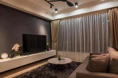 a living room with a large flat screen tv at Executive Seaview 2Bedrooms Macalister Georgetown 4-6pax in George Town