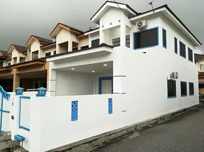a white house with a fence in front of it at Santorini 4 Bedrooms Full Air Cond Entire Home by Grab A Stay in Ipoh